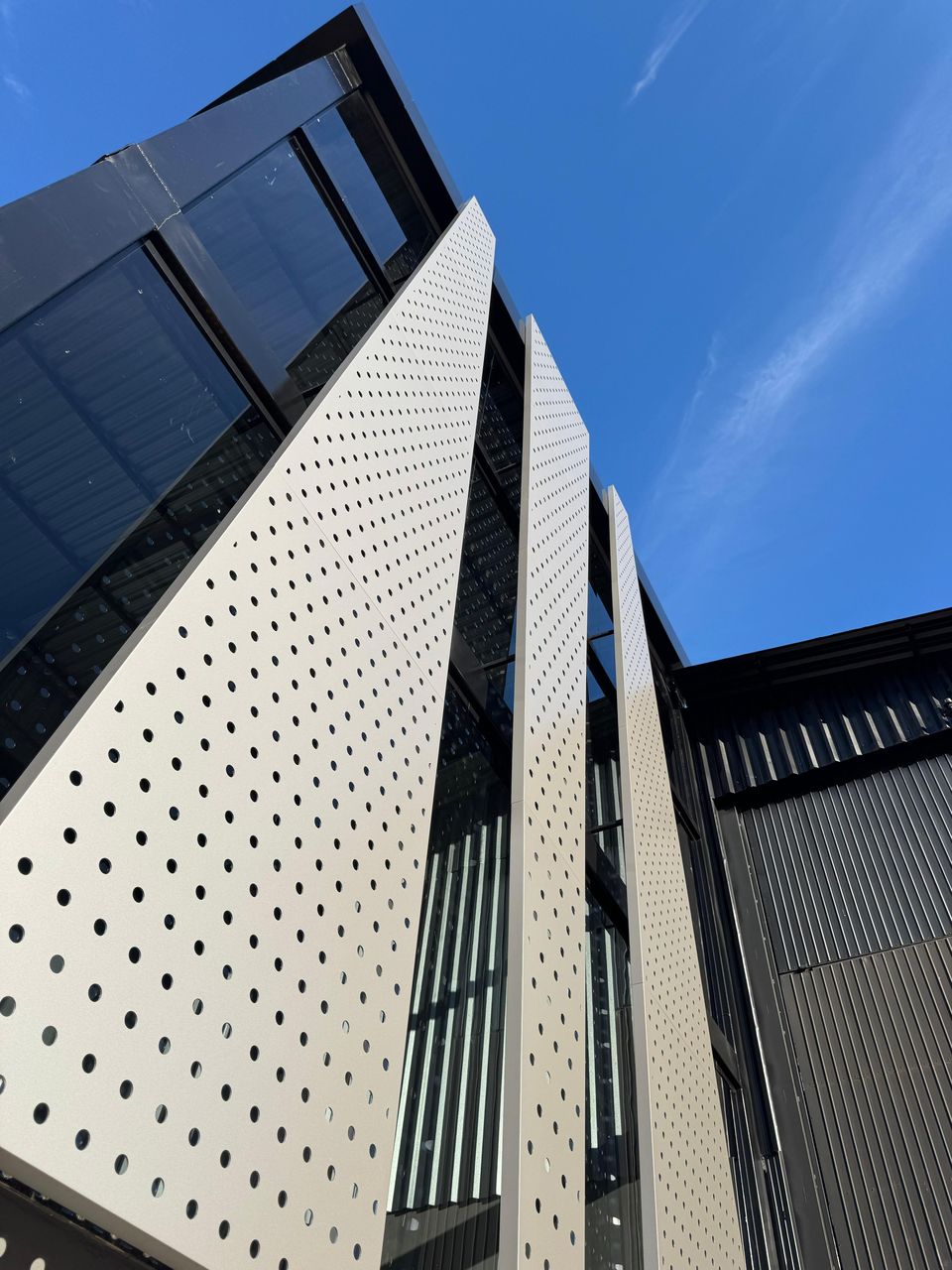Perforated ACM sheets on a corner