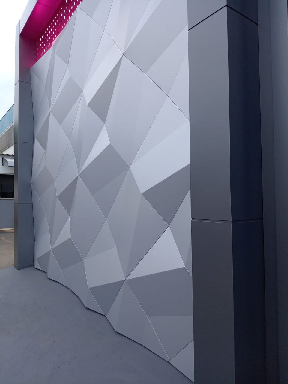 Faceted grey ACM wall