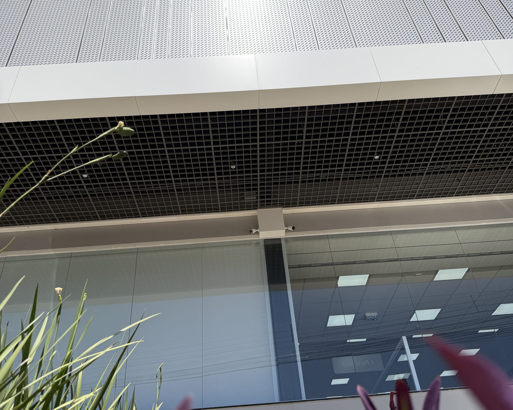 Long ACM band above the glazing and over a soffit