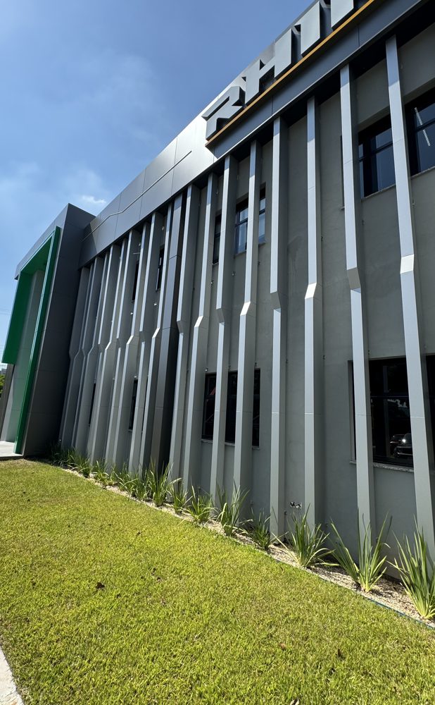 Grey ACM fins on a building front